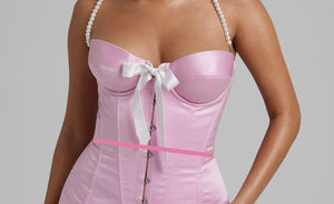 Woman wearing a corset with a line showing where to measure the waist size